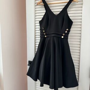 Black sleeveless mini skater dress - Size 6